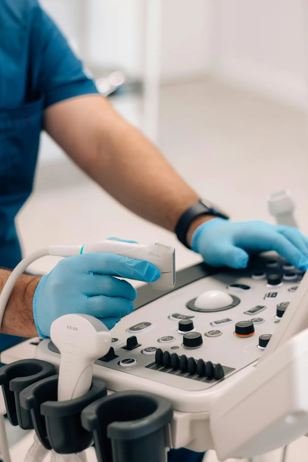 A vascular sonographer performing a duplex ultrasound of the leg veins